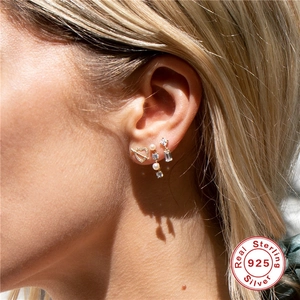 Elegant S925 sterling silver tassel earrings with pearls and zircons on a female model