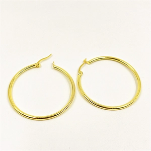 Classic minimalist gold-plated round hoop earrings for women on white background