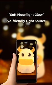 Macro shot of a silicone cow night light with warm soft eye-protection glowing light