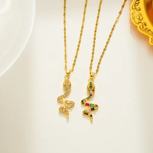 Close-up of hip-hop snake pendants in gold with clear and multi-colored cubic zirconia
