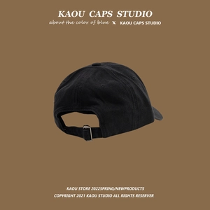 Classic black cotton baseball cap with adjustable metal buckle from back view