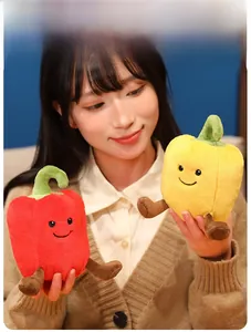 Close-up of adorable plush bell pepper toys with cute facial features and soft texture