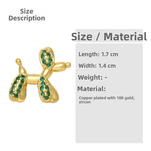 Detail view of gold-plated balloon dog earrings with green cubic zirconia pave setting
