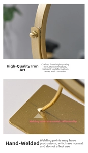 Detailed macro view of golden iron vanity mirror stand with secure screws and hand-welded joints