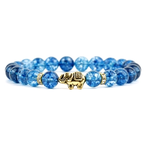 Detail of blue cracked crystal beaded bracelet with a gold elephant charm and spacers