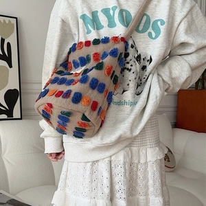 Beige plush bucket bag with colorful 3D dots decoration and crossbody strap