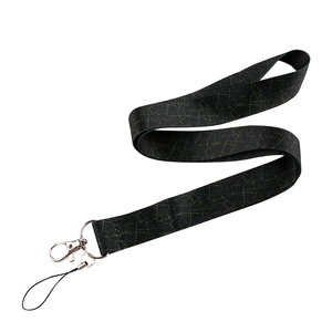 Detail of black fabric lanyard with green geometric lines and metal swivel spring clasp