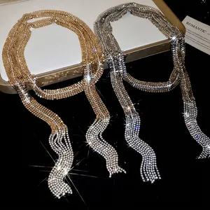 Sparkling long tassel fringe necklace in gold and silver finish with brilliant rhinestones