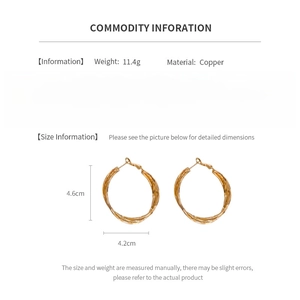Detail showing 11.4g copper gold twisted hoop earrings with 4.6cm height measurements