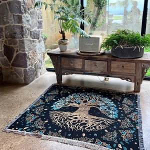 Detailed view of Tree of Life woven tapestry with golden Celtic knots and fringe edges