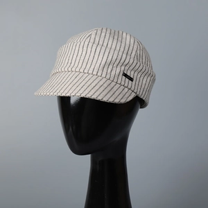Vintage pinstripe newsboy cap in beige and black with vertical lines for women