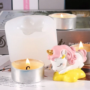 Detailed silicone mold showing a white unicorn on a yellow cloud candle and its mold