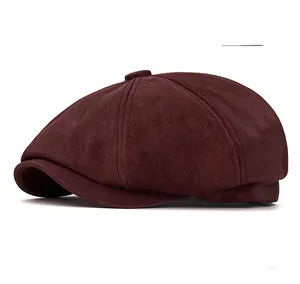 Detailed view of burgundy newsboy cap featuring premium suede texture and fine stitching
