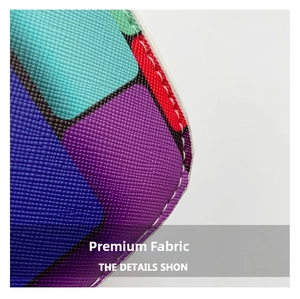 Detailed macro view of Saffiano leather texture with colorful geometric patchwork and stitching
