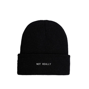 Black knitted beanie hat with NOT REALLY embroidery for winter warmth and fashion