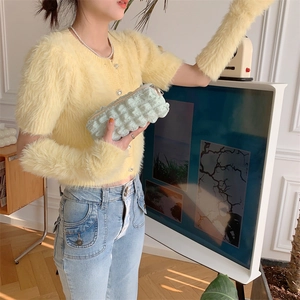 Soft yellow fuzzy knit cardigan with matching arm warmers for chic autumn winter fashion