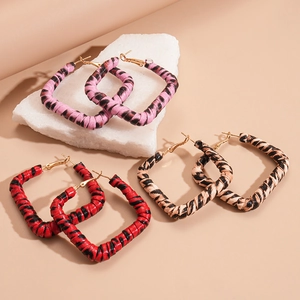 Three pairs of vintage leopard print square hoop earrings in pink, red, and brown colors