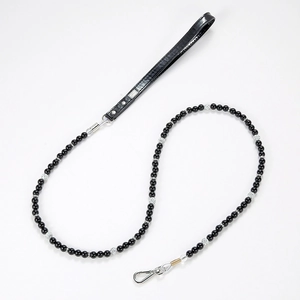 Detail view of pet leash with black pearl beads and premium leather handle with metal hook