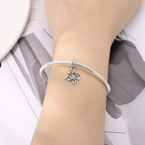 Silver snake chain bracelet with musical note and butterfly charms with colorful zircons