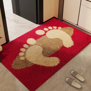 Durable red entryway rug with large beige footprint pattern on marble floor