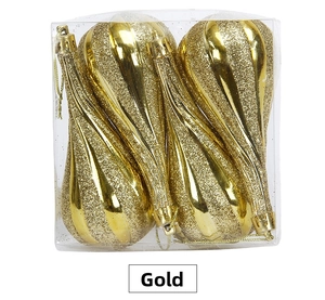 Detailed view of four gold teardrop Christmas ornaments with glitter and glossy stripes