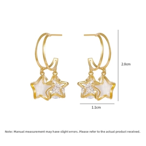 Detail of star drop earrings with dimensions 2.8cm height and 1.1cm width in gold