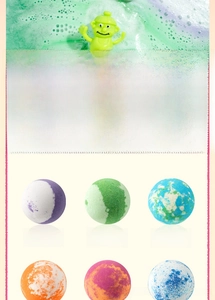 Detail showing bath bomb assortment with hidden toys, lavender and grape scents