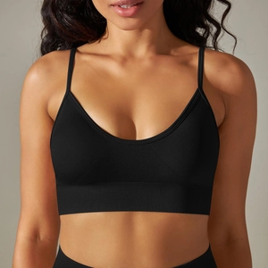 Macro shot of seamless knitted fabric texture and ribbed hem on a black sports bra