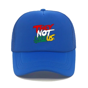 Detail of blue trucker hat featuring They Not Like Us colorful graffiti print and mesh back