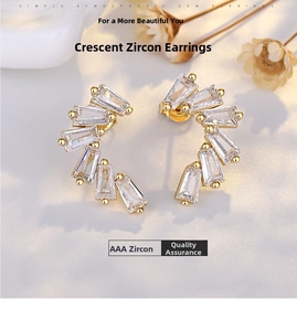 Detailed close-up of crescent moon earrings featuring baguette-cut AAA zircons in gold finish