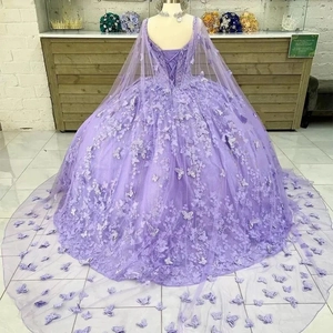 Detail of purple tulle gown featuring intricate 3D butterfly appliques and corset back closure