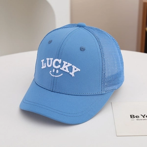 Detail of light blue mesh baseball cap with white Lucky embroidery and breathable fabric