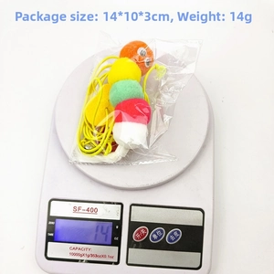 Detail view of colorful plush caterpillar cat toy in 14x10x3cm packaging on scale