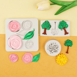 Macro view of flexible silicone molds showing detailed rose, tree and sunflower textures