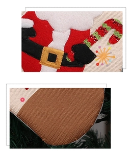 Detail of Christmas stocking featuring Santa Claus applique and sequin embroidery accents