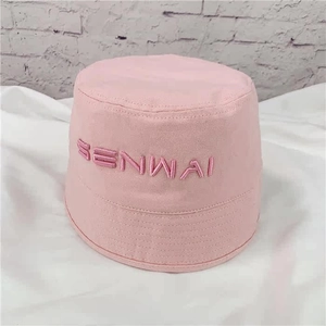 Close-up of a pink cotton bucket hat featuring embroidered SENWAI lettering detail