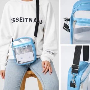 Transparent PVC crossbody bag with blue trim and adjustable strap for summer