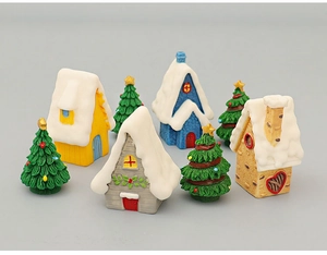 Detail of 7-piece miniature Christmas village set with snowy resin houses and tiny trees