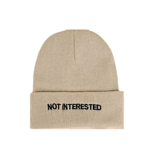 Beige knit beanie with Not Interested embroidery, warm minimalist winter skull cap for all