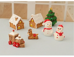 Detailed set of 7 miniature Christmas resin figurines including snow house and reindeer