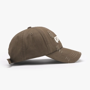 Distressed brown baseball cap with 3D letter embroidery and vintage torn cotton fabric
