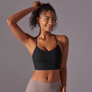 Detail of black sports bra featuring breathable fabric and supportive wide underband