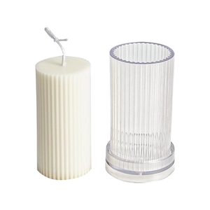 Ribbed pillar candle with transparent plastic DIY mold and base on white background