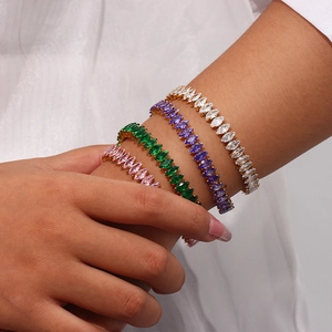 Luxurious stainless steel cuff bracelet with marquise-cut colorful zircons on a model