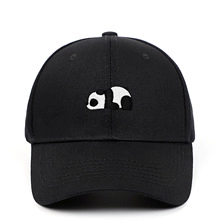 Close-up detail of a panda embroidery on a black vintage washed cotton baseball cap