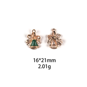 Detail view of 16x21mm golden Christmas bell charms with green enamel for DIY jewelry