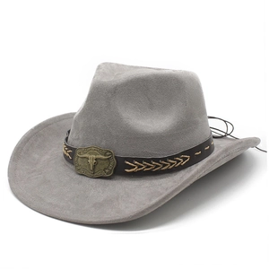 Detail of grey suede cowboy hat with brown leather band and bronze bull head buckle