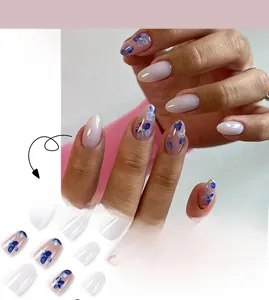 Short press-on nails featuring blue gradient flowers and white marble nail art design