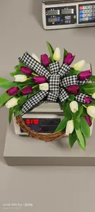 Detailed view of artificial tulip wreath showing 0.170kg weight on a digital scale