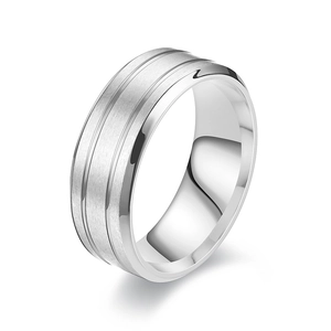 Wide brushed titanium steel ring for men with polished grooves on a white background
